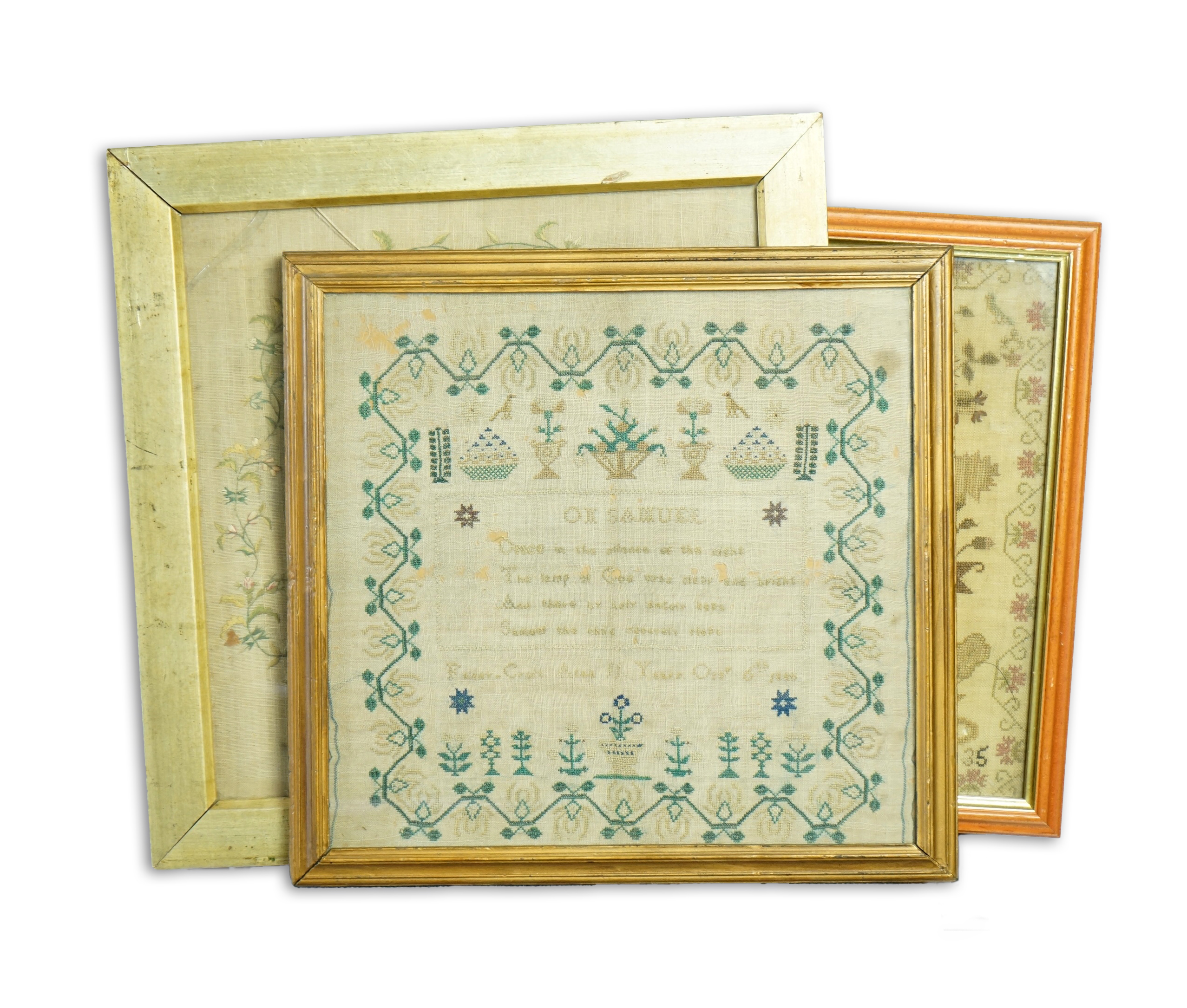 An 18th century sampler dated 1797 by Ann Howse, worked with fine floral garland and a large embroidered flower and verse within, together with two 19th century samplers, one by Anna Kemp age 8 years dated 1835, the othe